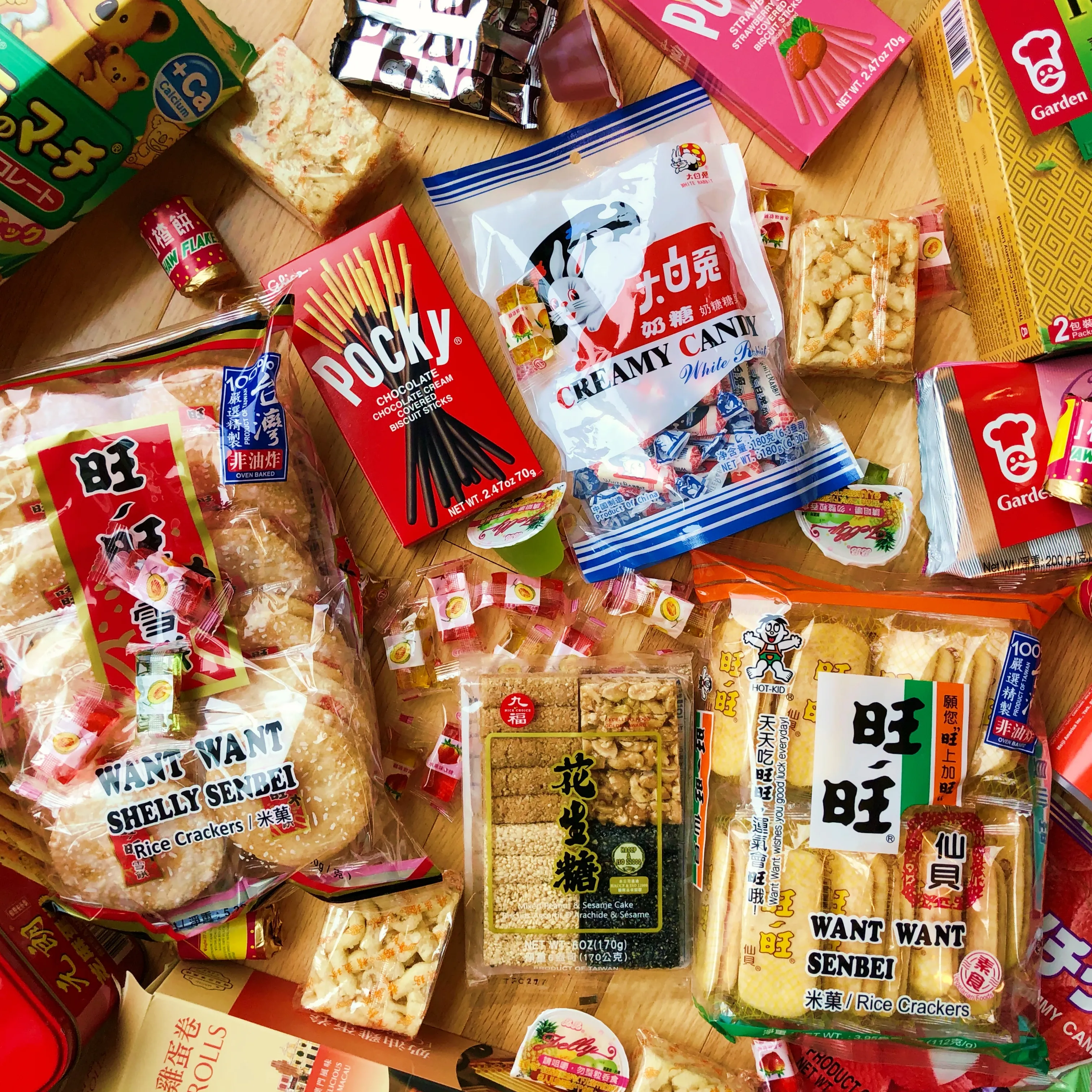 Asian snacks flat lay — Pocky, Want Want, rice crackers